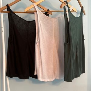 Three Free people tank tops (black green white) small